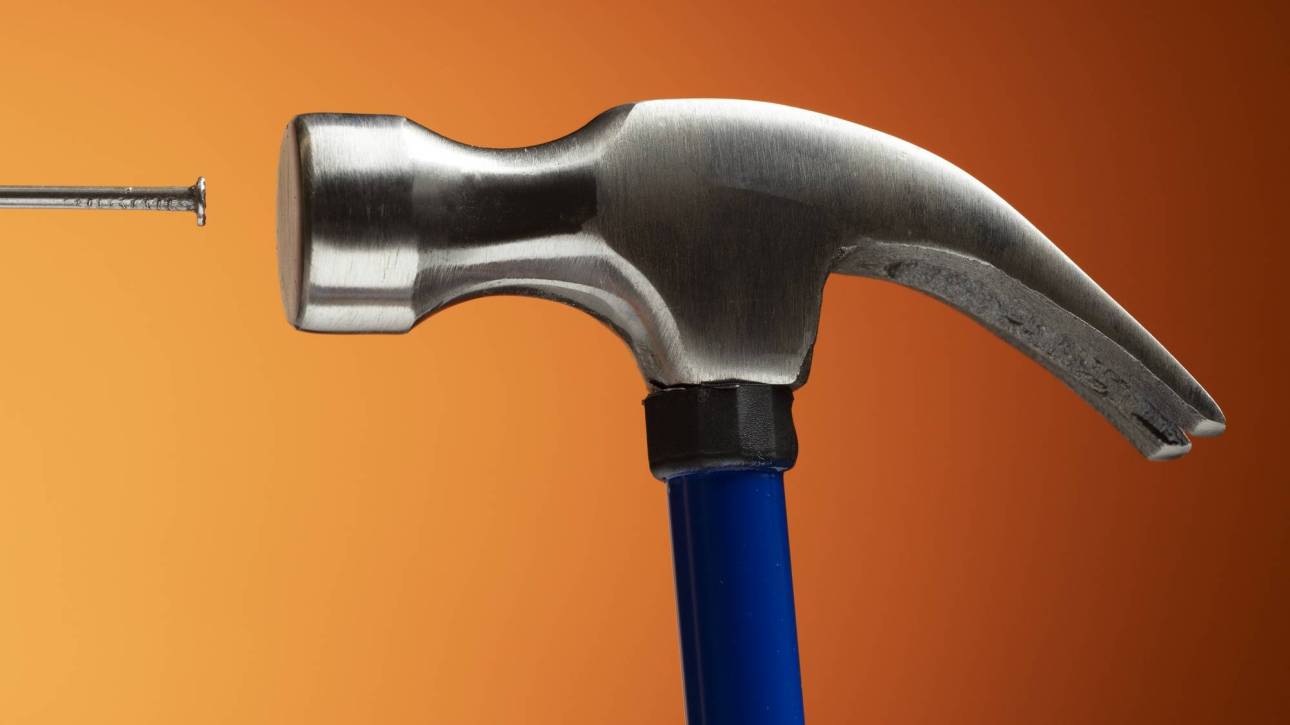 view-steel-hammer-construction-work-with-nails